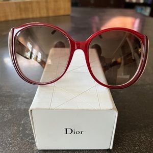 Dior oversized red and white sunglasses with tortoise temples.